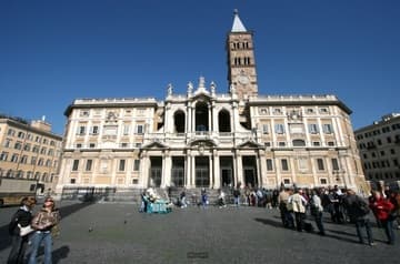 View of the very large facade from the east. Although the ancient basilica was built in the 5th century, most of the exterior and interior decoration dates from the 18th century. The campanile (bell tower) is from the 14th century.