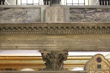 Detail of the east arcade in the 6th-century basilica, which forms the chancel of the present church. At the top is a 5th-century pedestal with Christian symbols. Basilica di San Lorenzo fuori le Mura (Saint Lawrence outside the Walls), Rome, Italy.