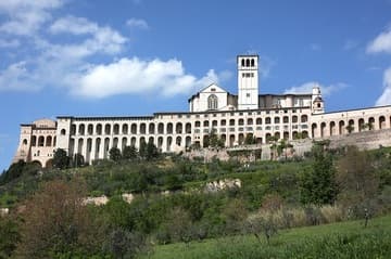 View of the basilica and Franciscan convent from below. The convent was constructed at the same time as the basilica (around 1230-50), with the impressive supporting portico added by the end of the 13th century.
