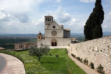 View of the Upper Church (completed 1280) from the east, with Tau cross and Pax (Peace) landscaped in the gardens.
