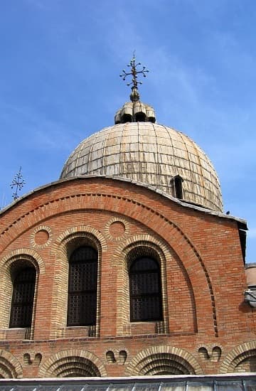 Byzantine brick facade and dome on the south exterior of the Basilica di San Marco, Venice, Italy.