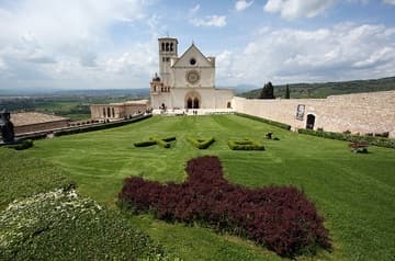 View of the Upper Church (completed 1280) from the east, with Tau cross and Pax (Peace) landscaped in the gardens.