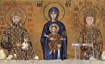 Deesis Mosaic in the Hagia Sophia, c. 1118. This mosaic depicts the Virgin Mary holding the Christ Child, who holds a scroll and makes the sign of benediction. As in the parallel mosaic, the emperor offers an apokombion (purse with gold coins weighing about 3 kgs) while the empress presents a scroll inscribed with a list of her donations to the church. In this mosaic, the emperor is John II Comnenus (1118-1143) and his wife is the Hungarian princess Irene. The empress is shown with blond hair and rosy cheeks, shy and a little ill at ease, having been brought up far from the strict etiquette of the sophisticated Byzantine court. This mosaic extends around the corner, where the portrait of their son Alexius was added the year he was made co-Emperor. The 17-year old Alexius looks pale and frail; in fact, he died not long after his coronation.